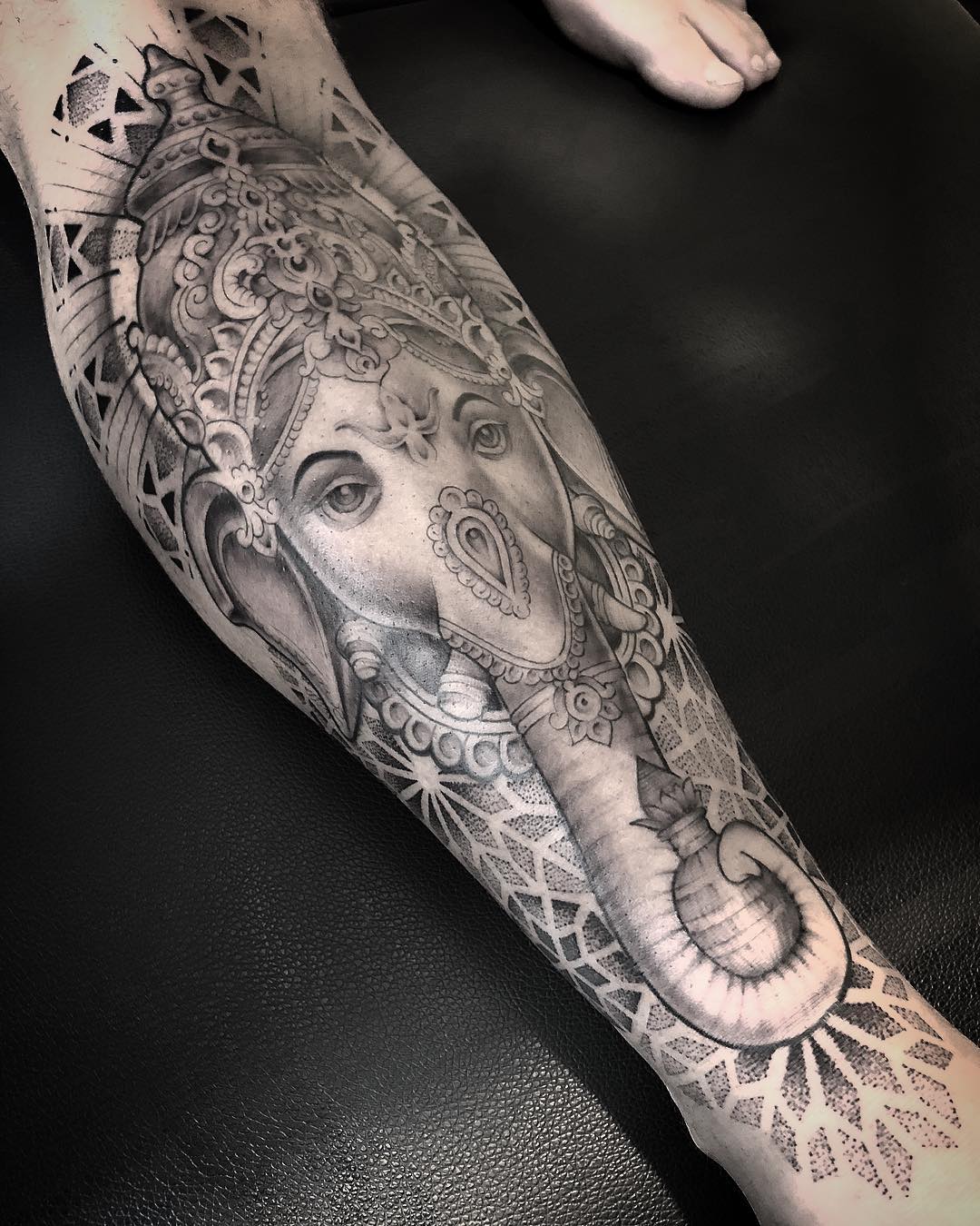 ganesh tattoo by @thaisvalentetattoo