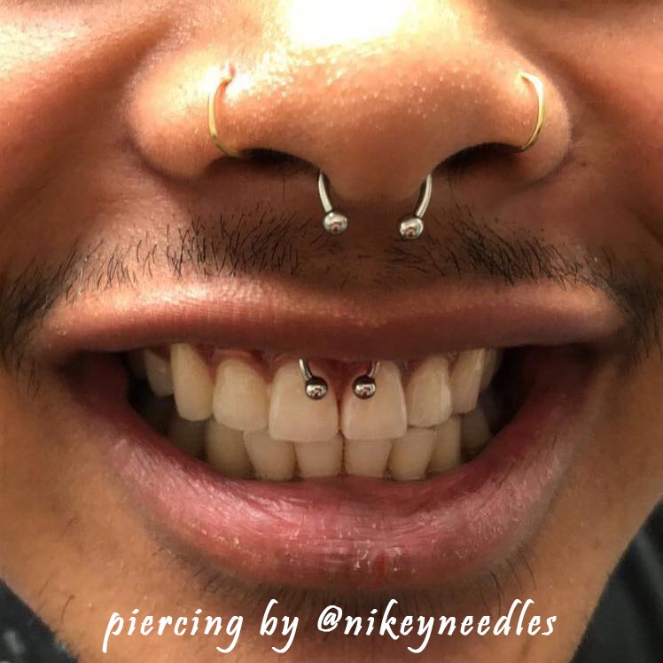 smiley piercing by @nikeyneedles